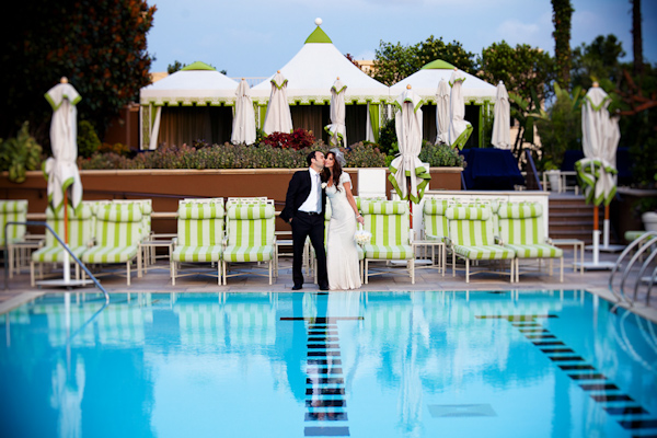 portrait of happy couple by swimming pool - photo by Southern California wedding photographers Callaway Gable